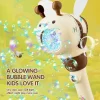 Child holding a handheld light-up bubble machine with colorful bubbles floating outdoors (2).