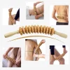 Person using a wooden fascia massager on their back for muscle relief (3).